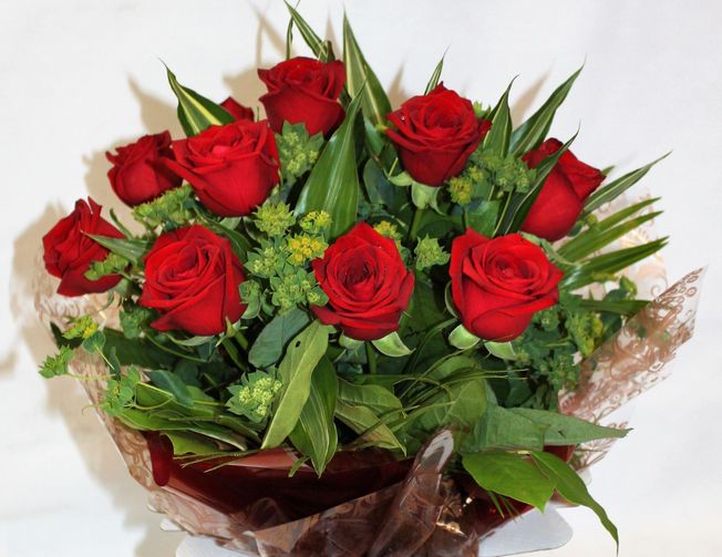 Dozen Red Rose Hand Tied in an aqua pack